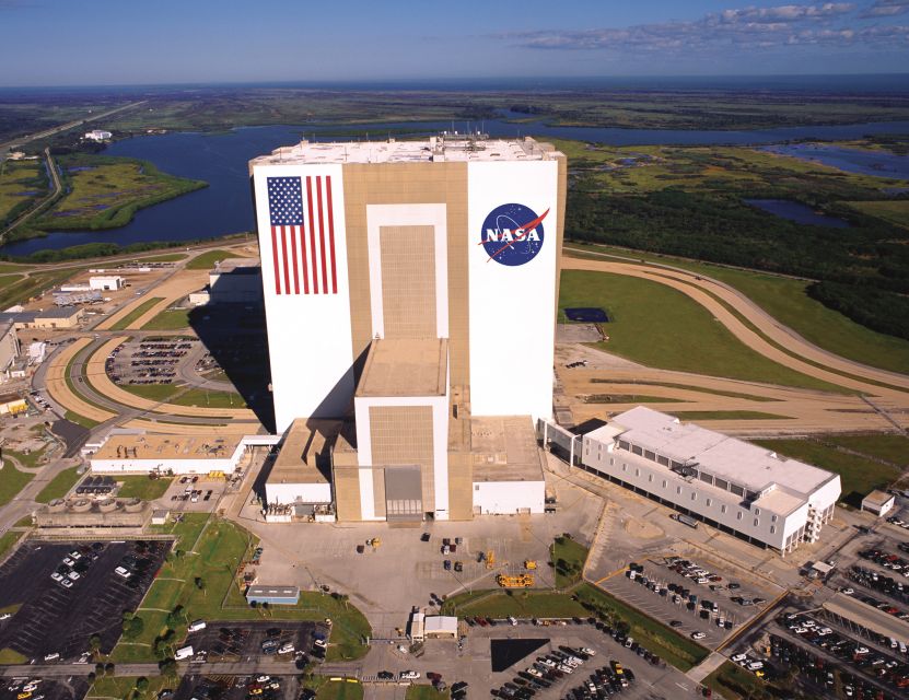 From Orlando: Kennedy Space Center Trip with Transport - Under Saturn V and touching moon rock: the tactile moment