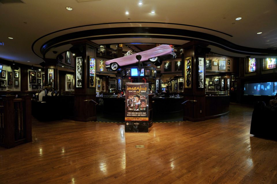 Meal at Hard Rock Cafe Orlando at Universal CityWalk - Memorabilia in the building: Elvis upstairs and the pink Cadillac center