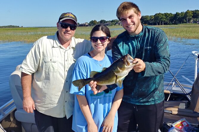 Private Pontoon Fishing Charter on Lake Tohopekaliga in FL - The Boat Setup: A 23-Foot Pontoon with Overhead Cover